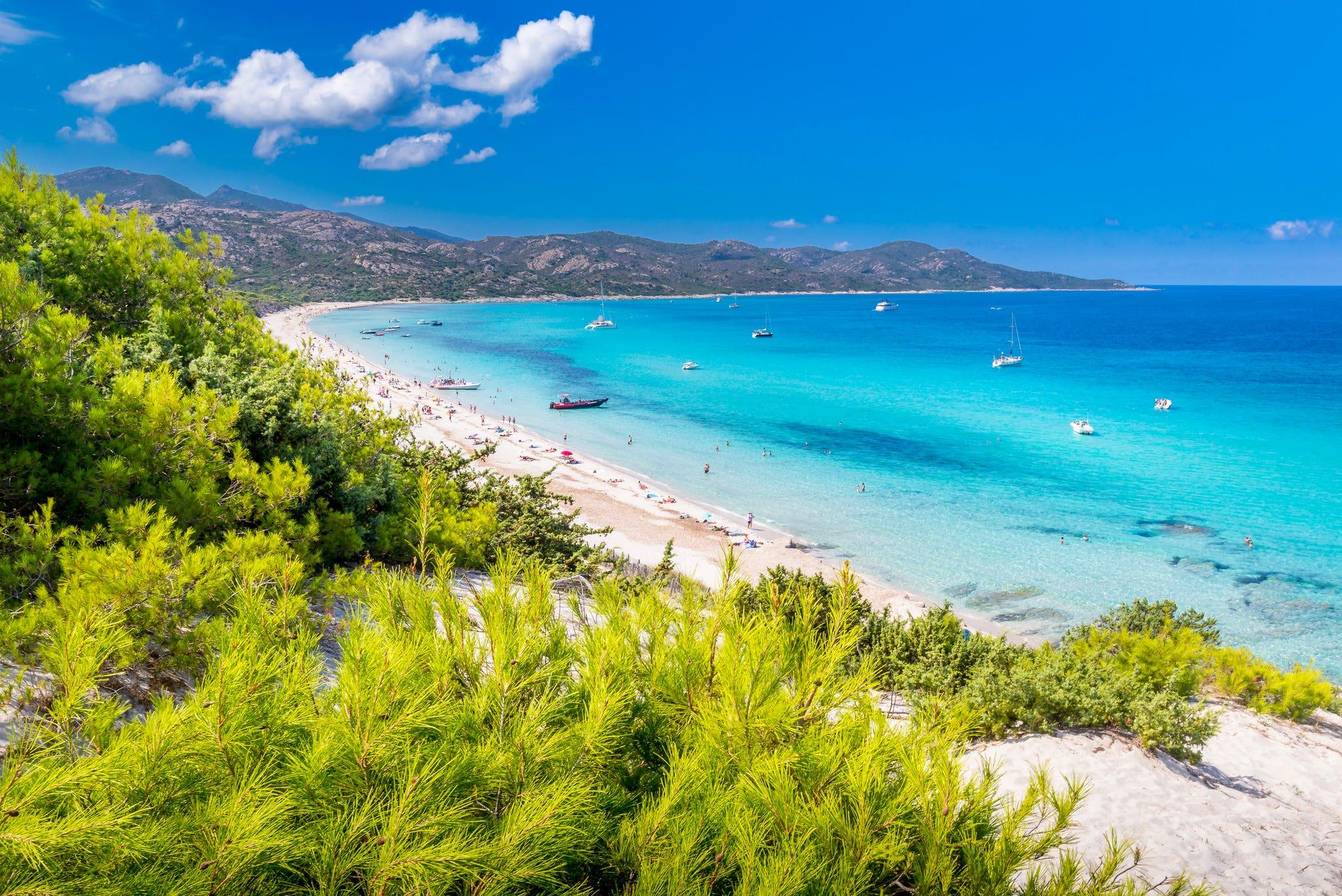 Hidden beaches Europe with bright blue sea and a peaceful sandy shoreline
