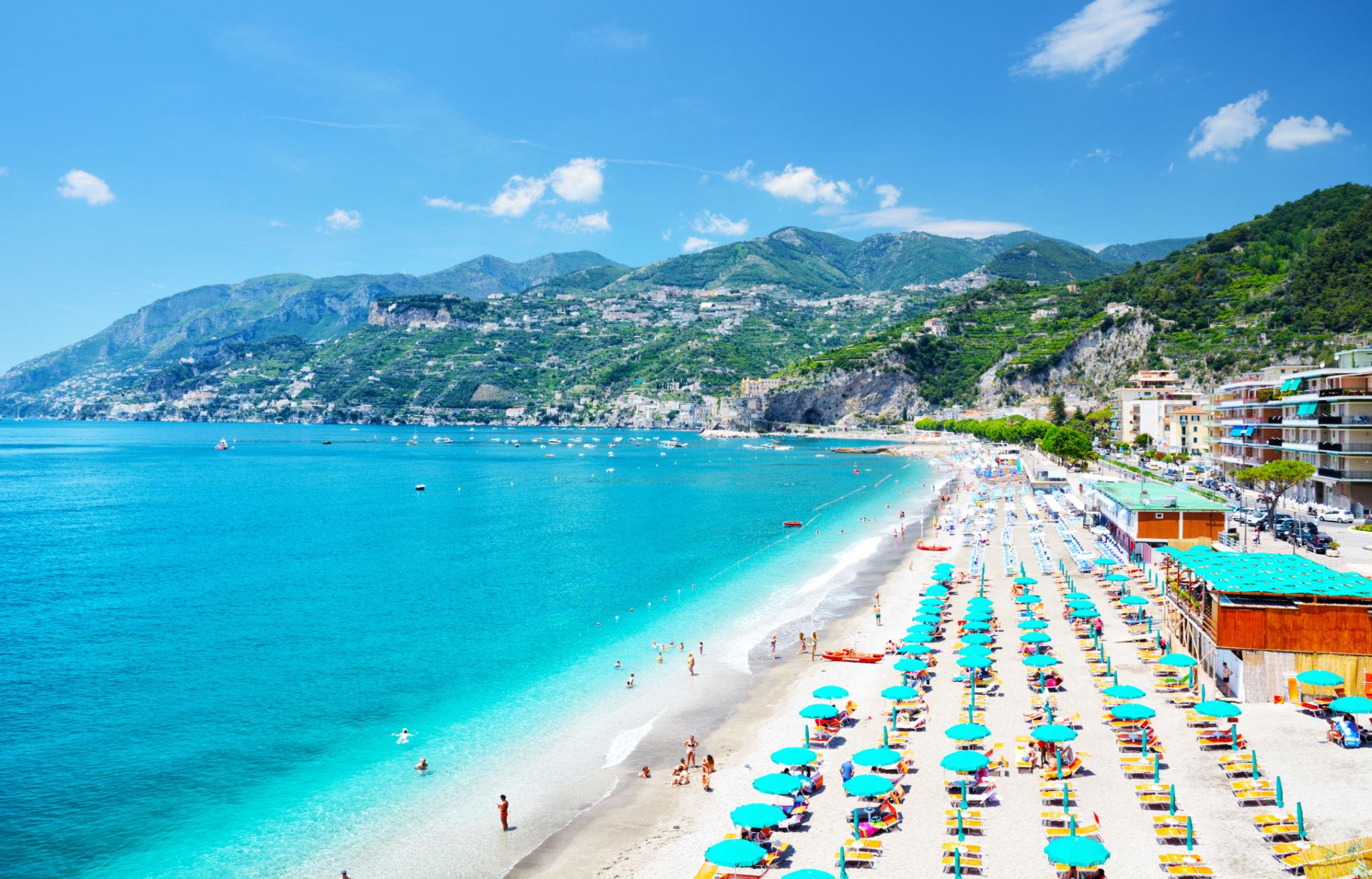 Best beaches Amalfi Coast wide shoreline with bright umbrellas