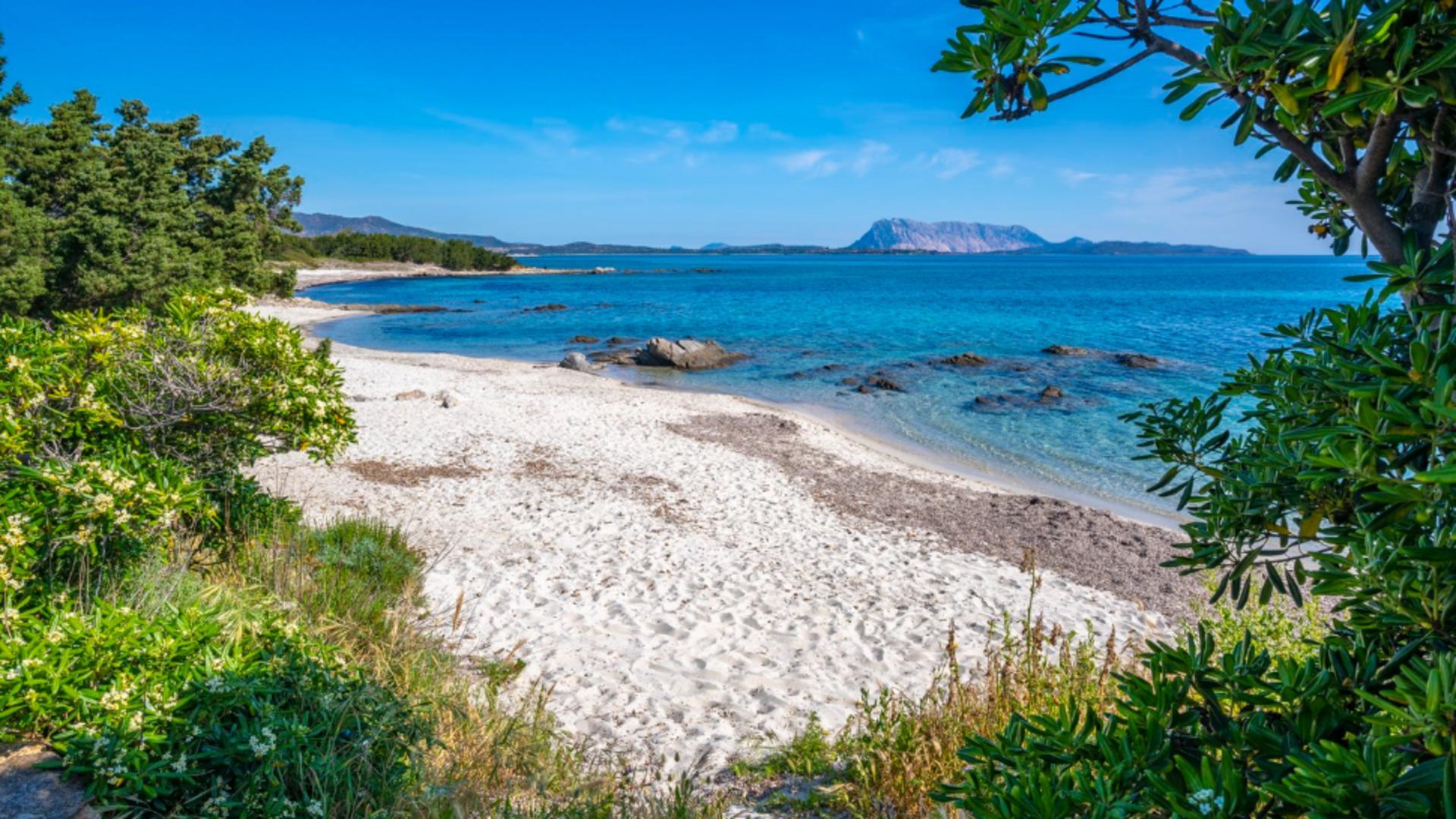 Hidden beaches Europe showing a white sand beach away from crowds