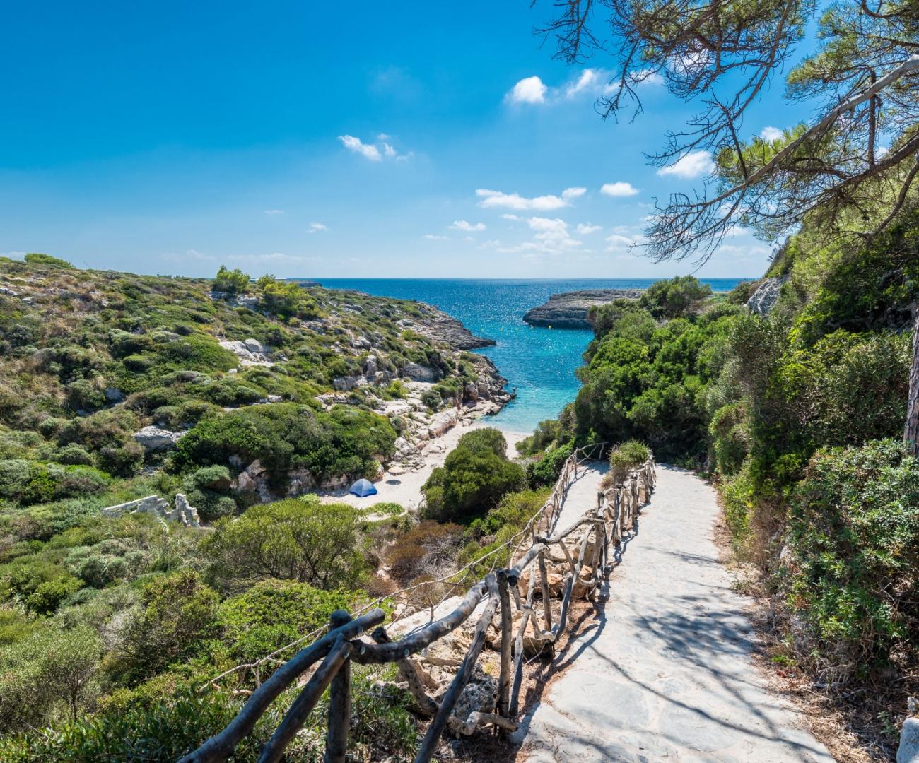 Hidden beaches Europe featuring rocky shore paths and swimming spots