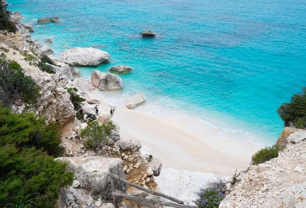 Hidden beaches Europe featuring a small white sand cove with turquoise water