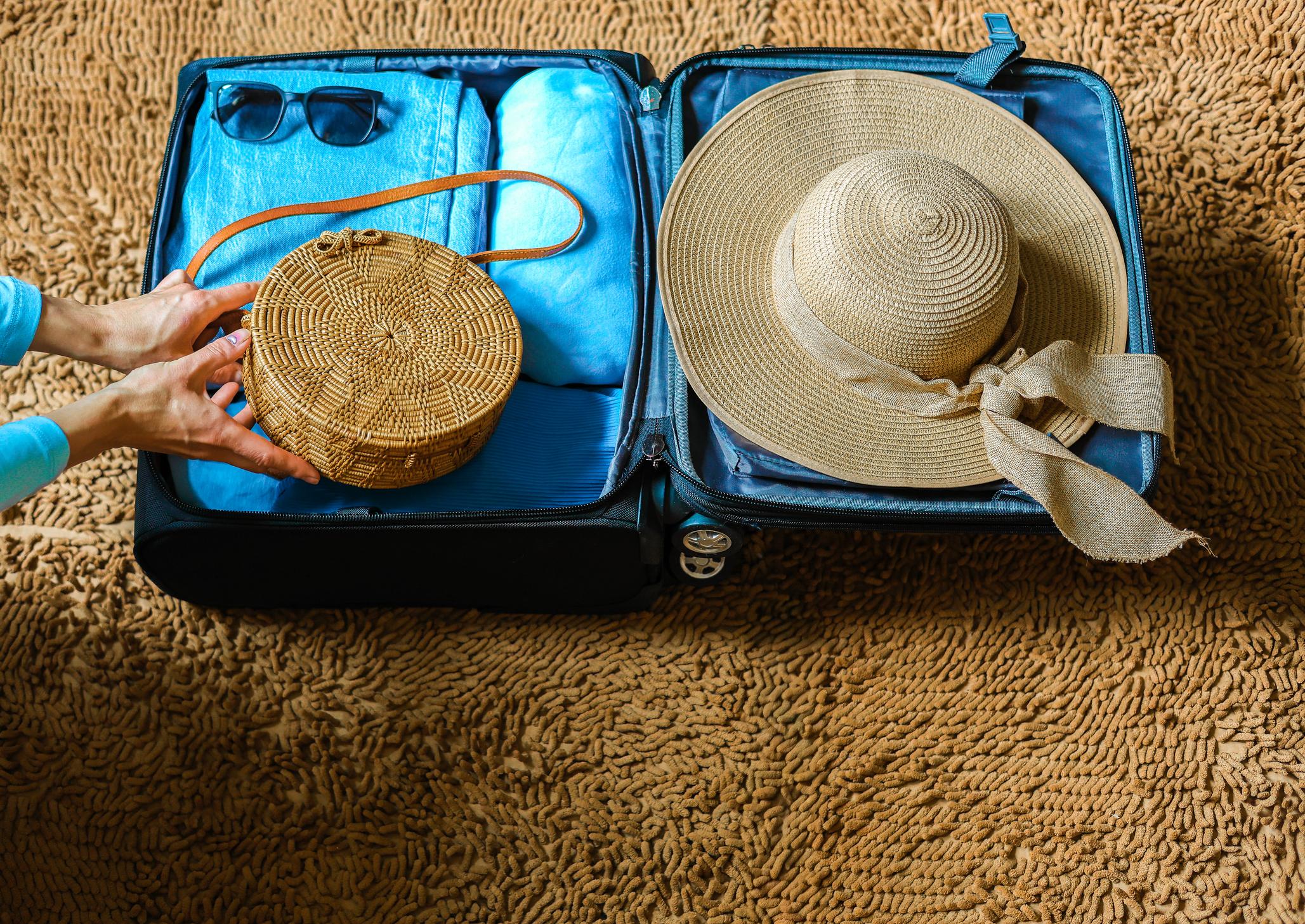 Warm weather suitcase with accessories using the 5-4-3-2-1 packing method