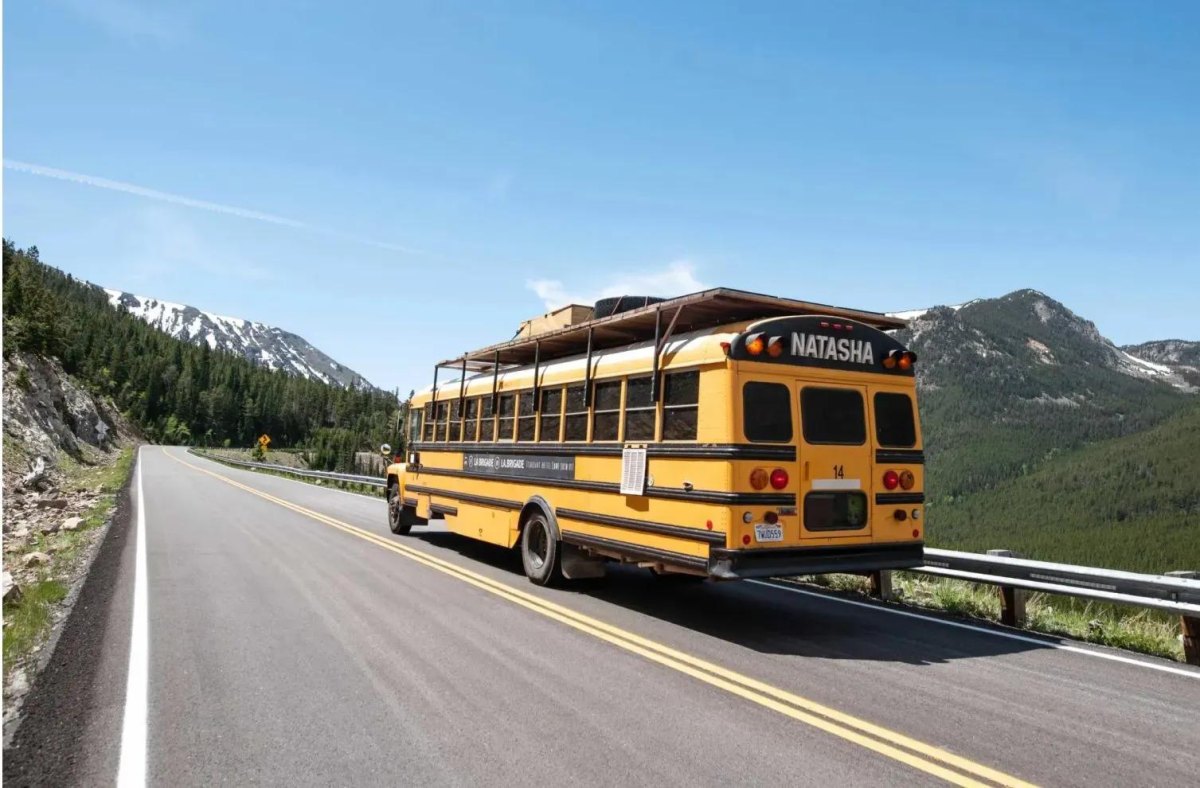 Adventure bus on scenic mountain road