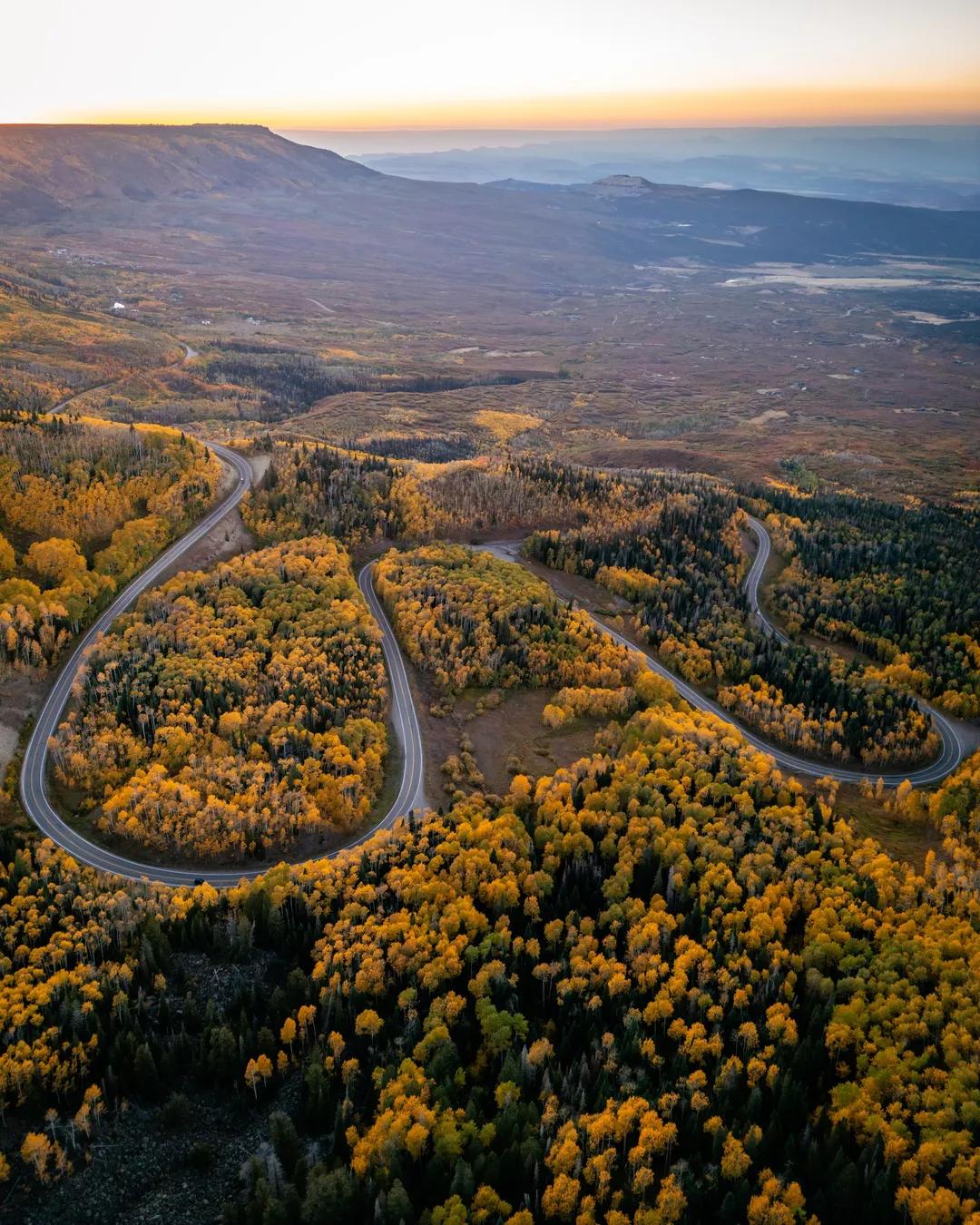 Colorado scenic drive winding through forests and broad mountain valleys