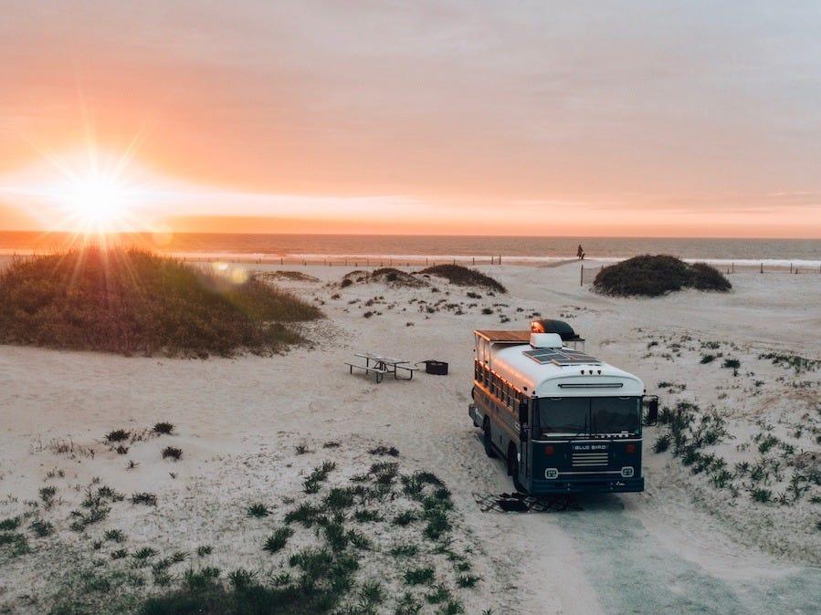 Bus parked beside ocean beach