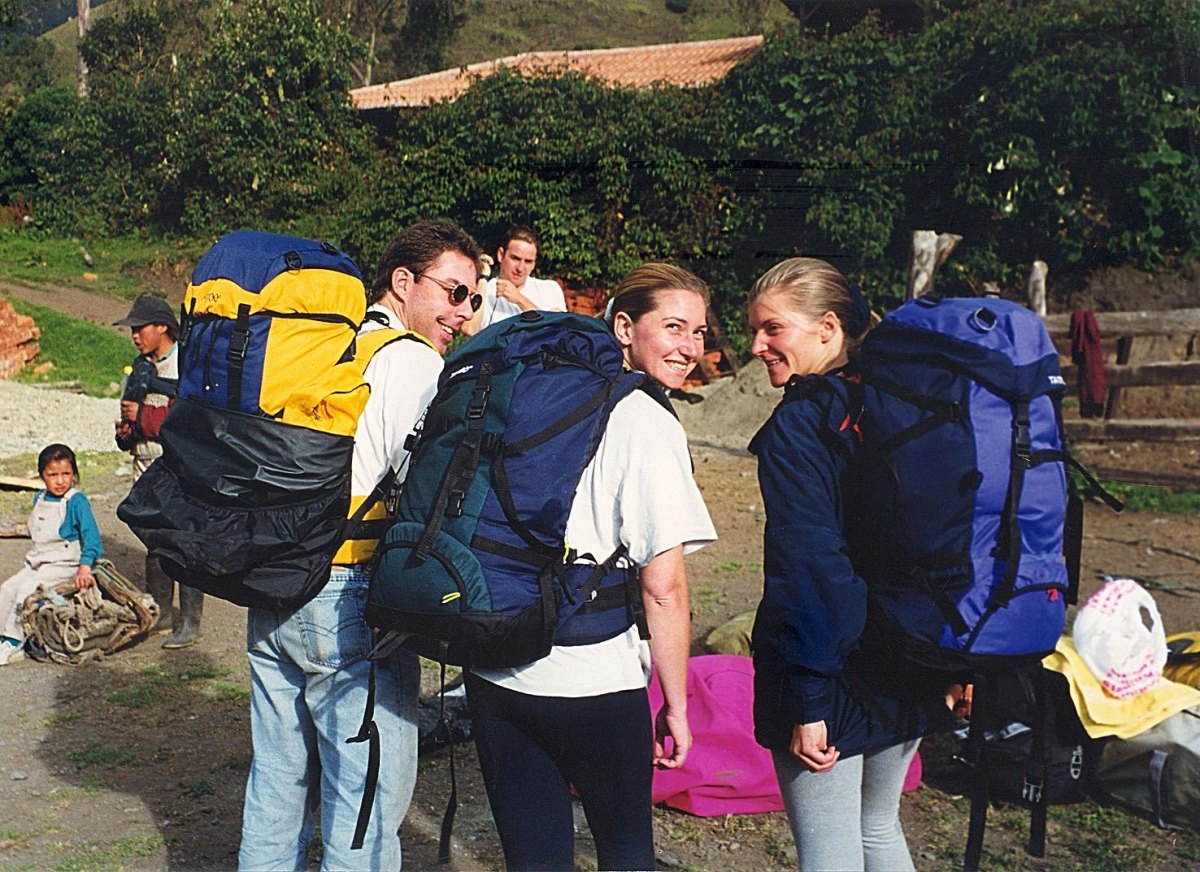 Friends backpacking with travel bags