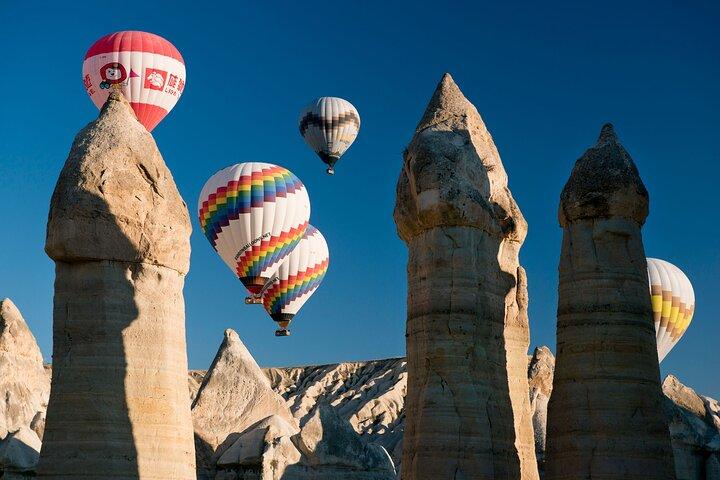 Cappadocia balloons over valleys