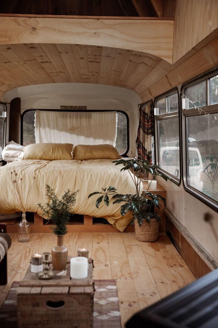 Cozy converted bus interior with wood design