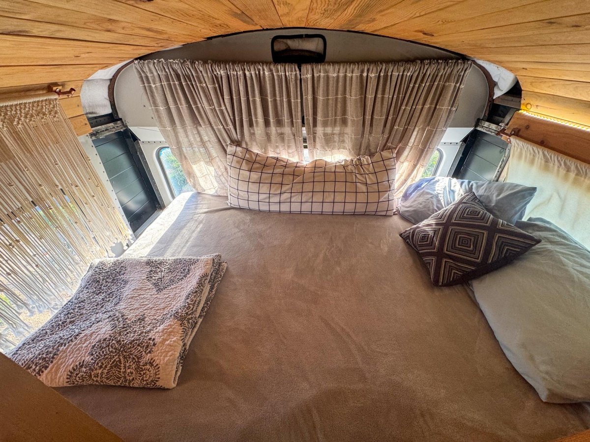 Cozy bus camper sleeping area