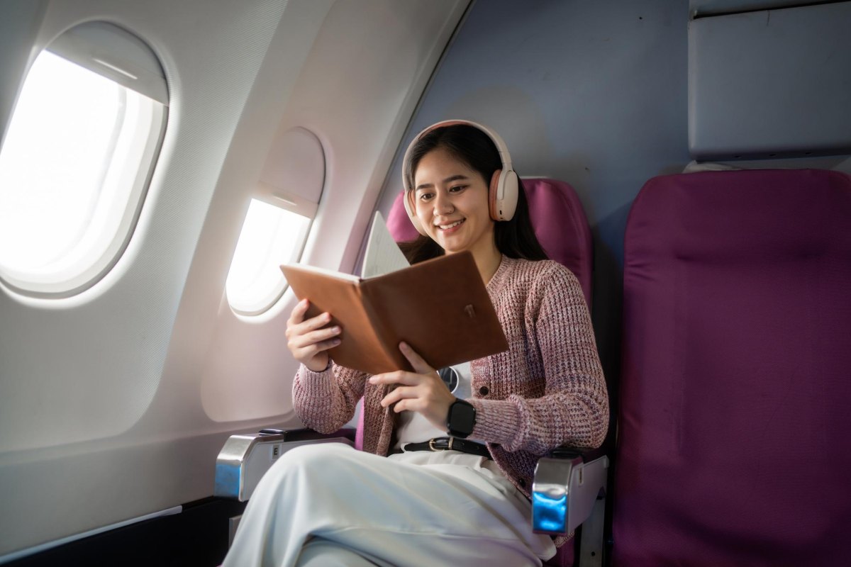 Flight comfort items headphones book