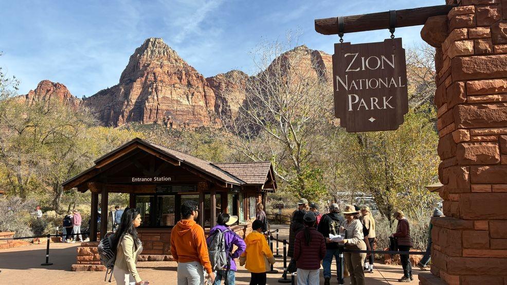 Park entrance area with visitors preparing for a national park visit