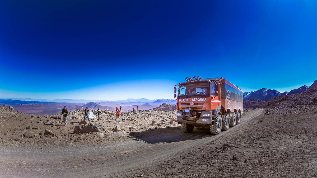 Extreme overland bus in desert landscape