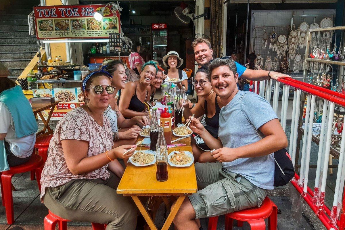Friends sharing local food experience