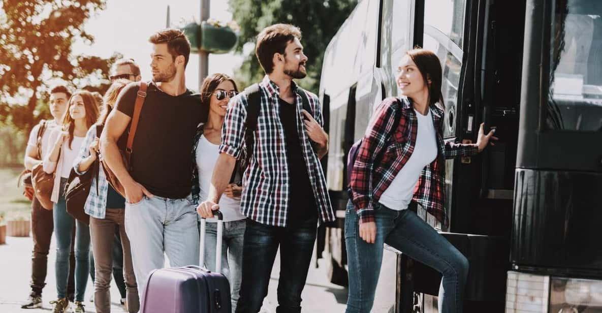 Travelers boarding tour bus