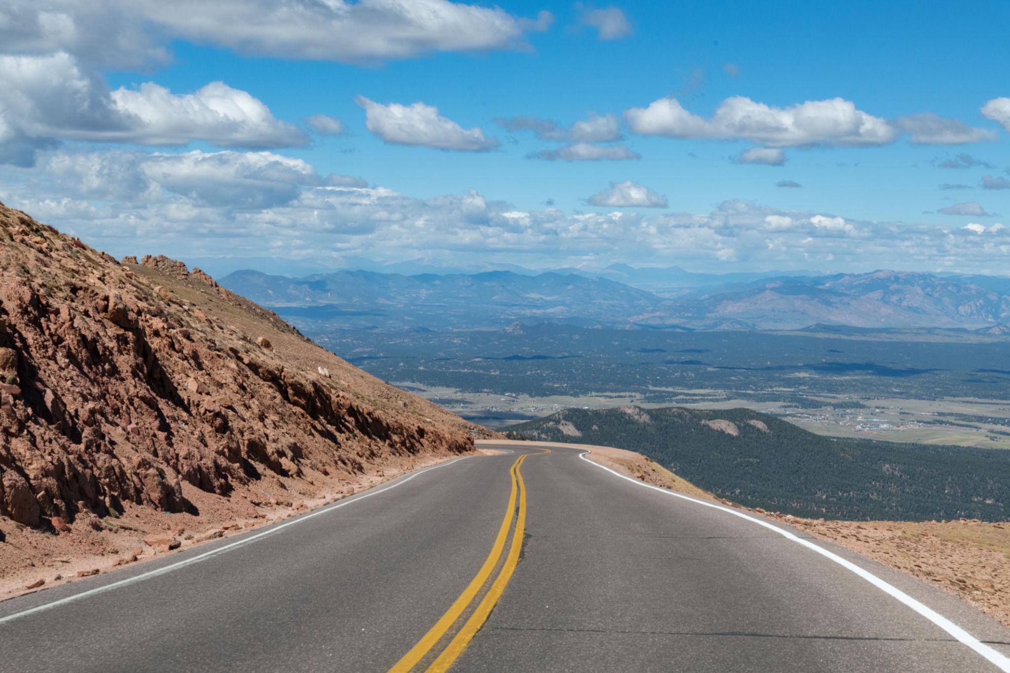 Colorado scenic drive across high desert mountains with distant ranges