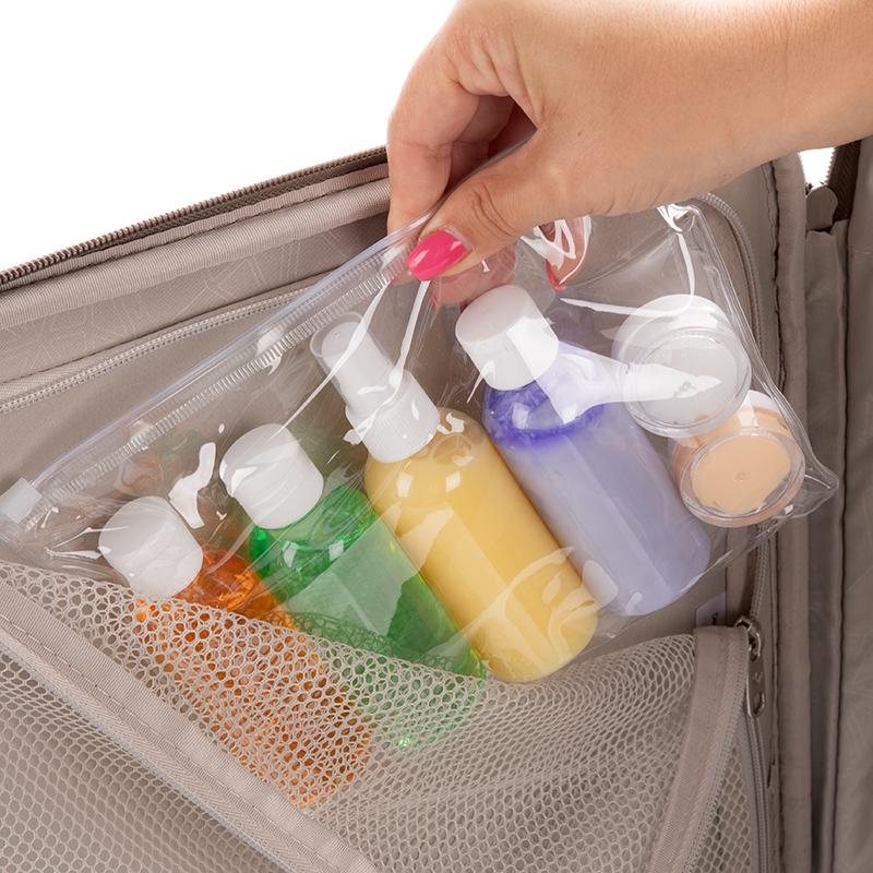 Clear toiletry pouch inside suitcase for easy travel organisation