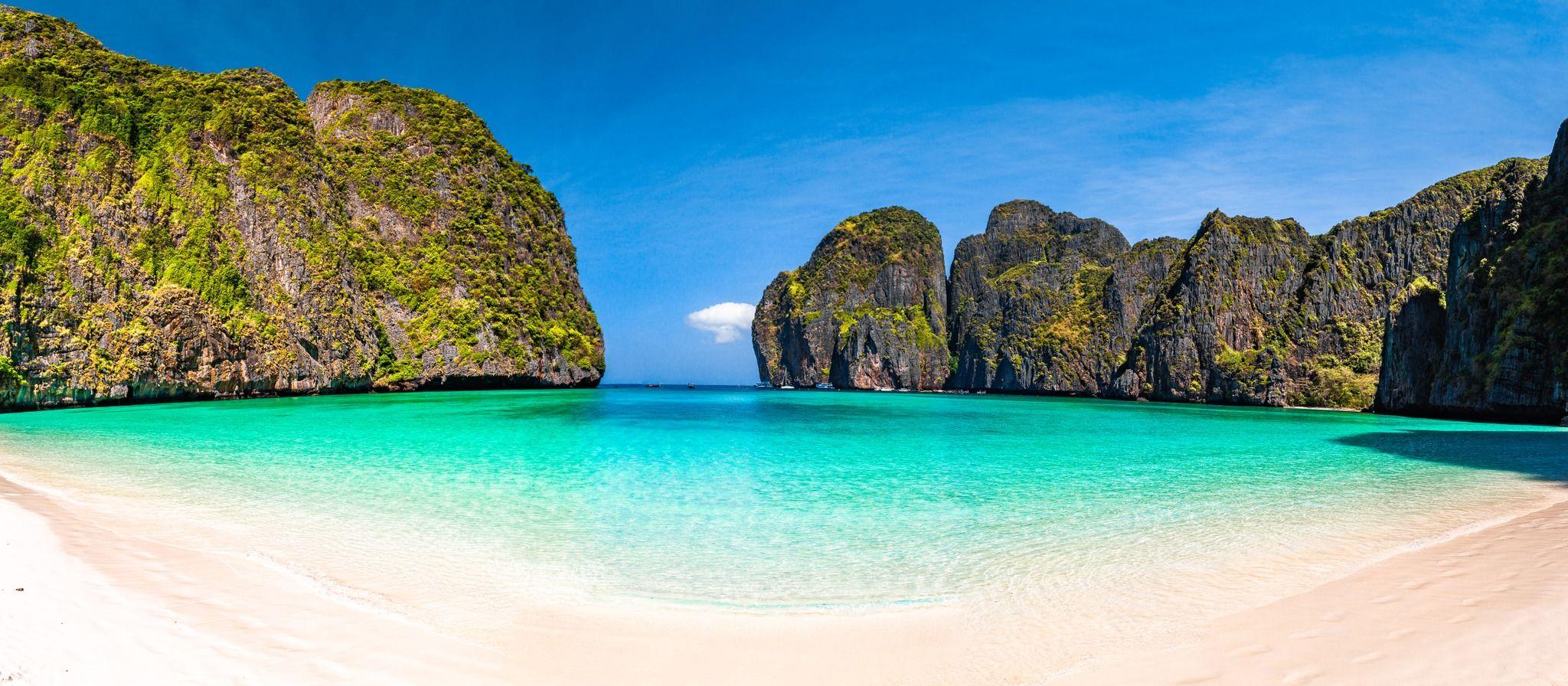 Maya Bay surrounded by Thai limestone cliffs