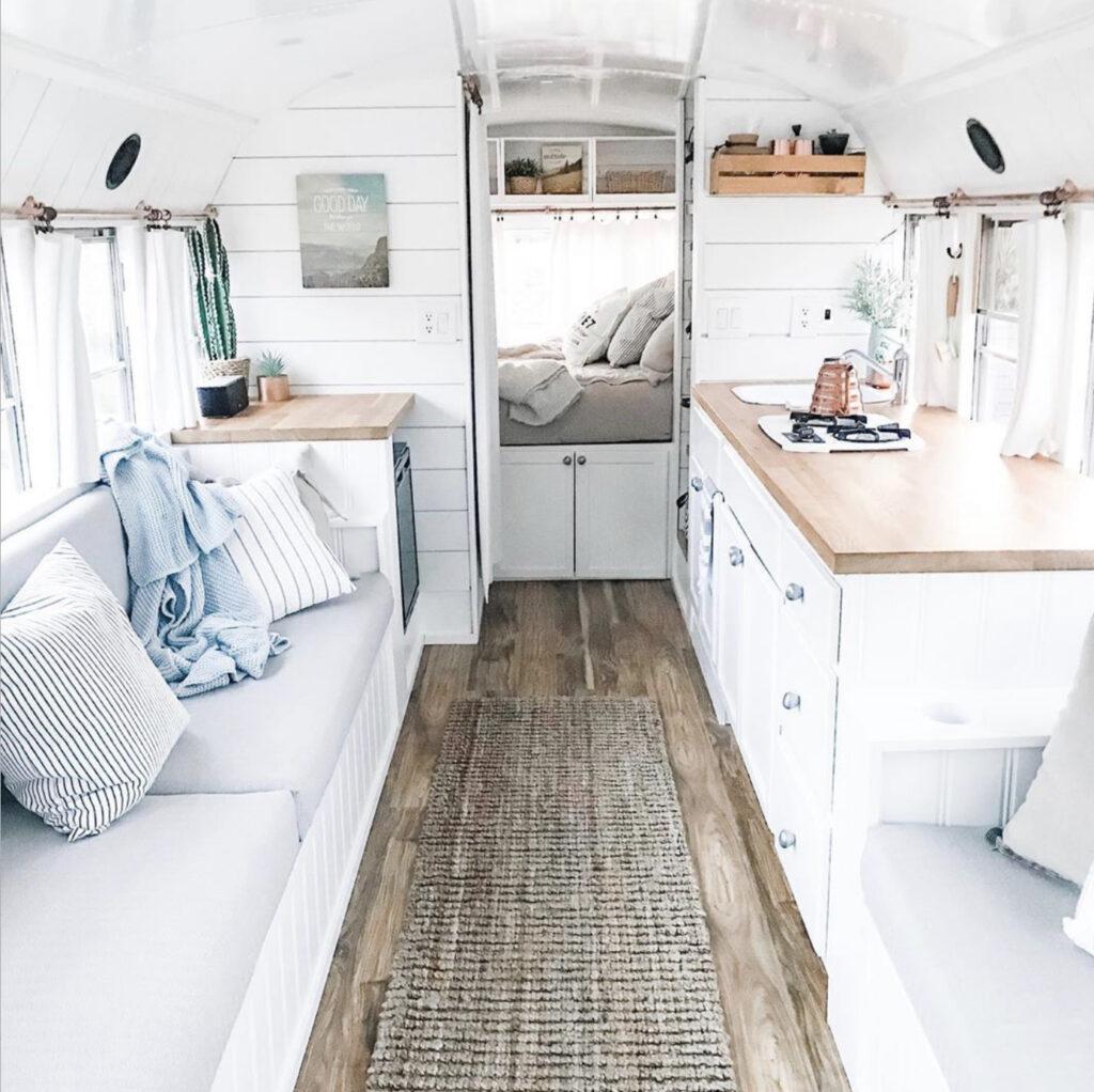 Minimalist school bus conversion interior design