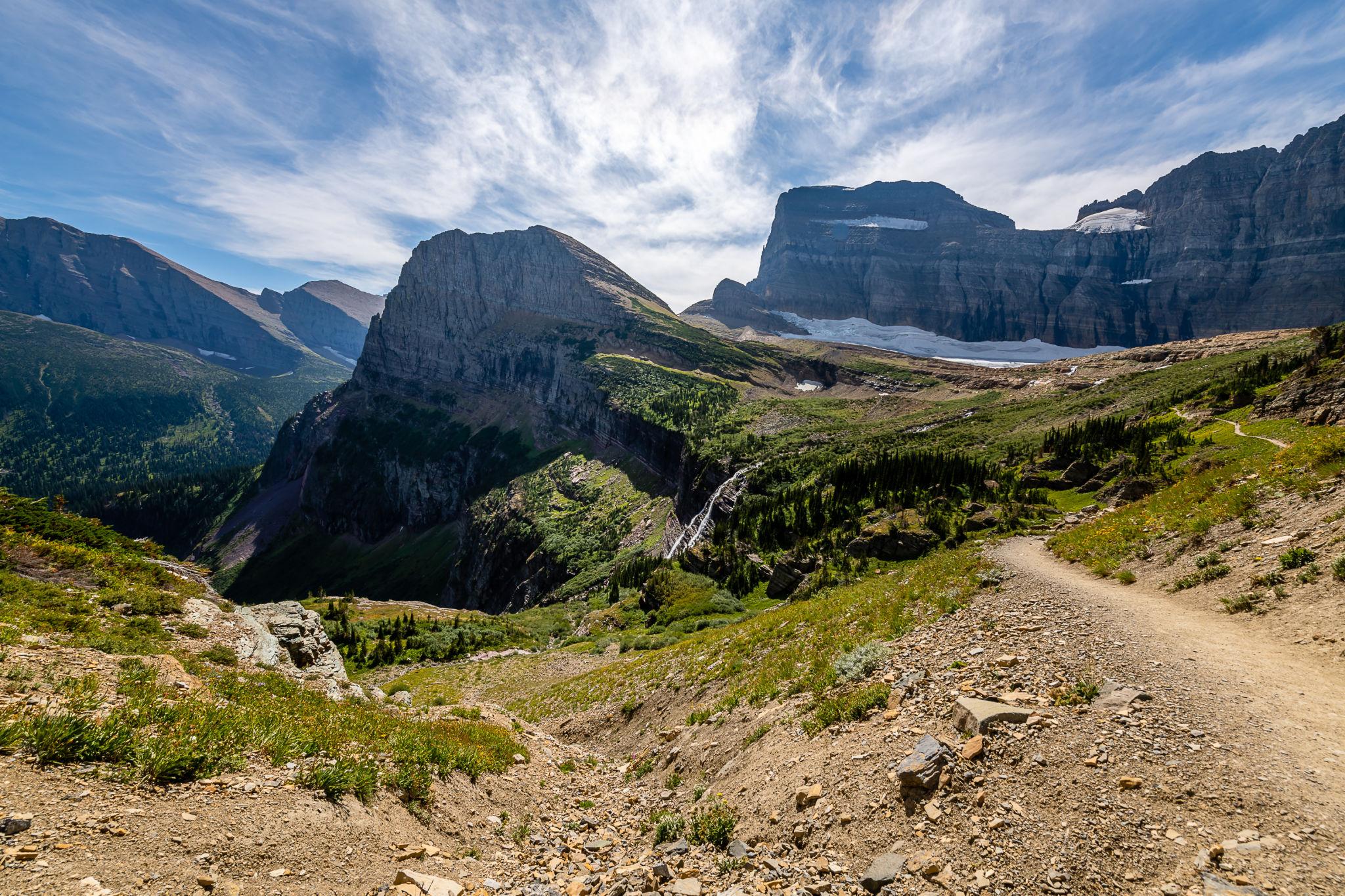 Rocky alpine trail and peaks in Glacier National Park scenery