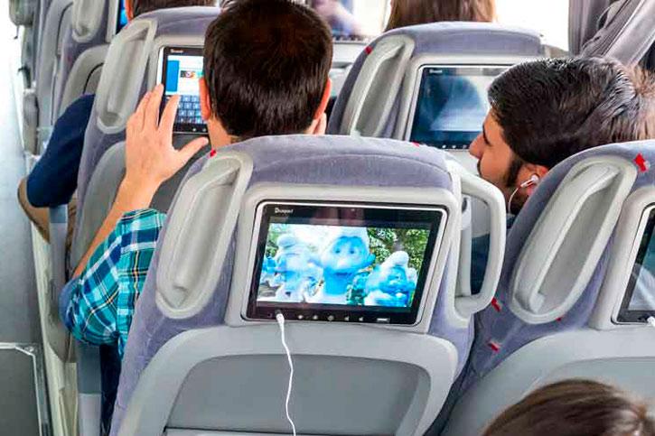 Passengers using WiFi on modern bus