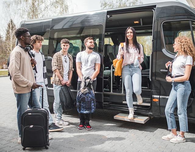 Group travellers boarding modern coach