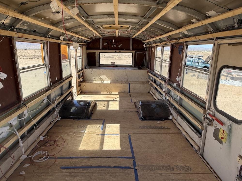 Empty bus interior after seats removed