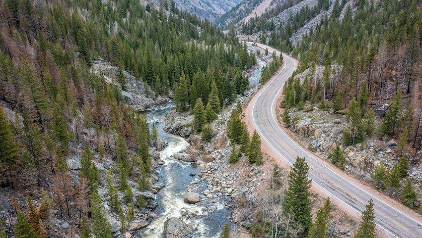 Rocky Colorado canyon road scenic drive beside a flowing river