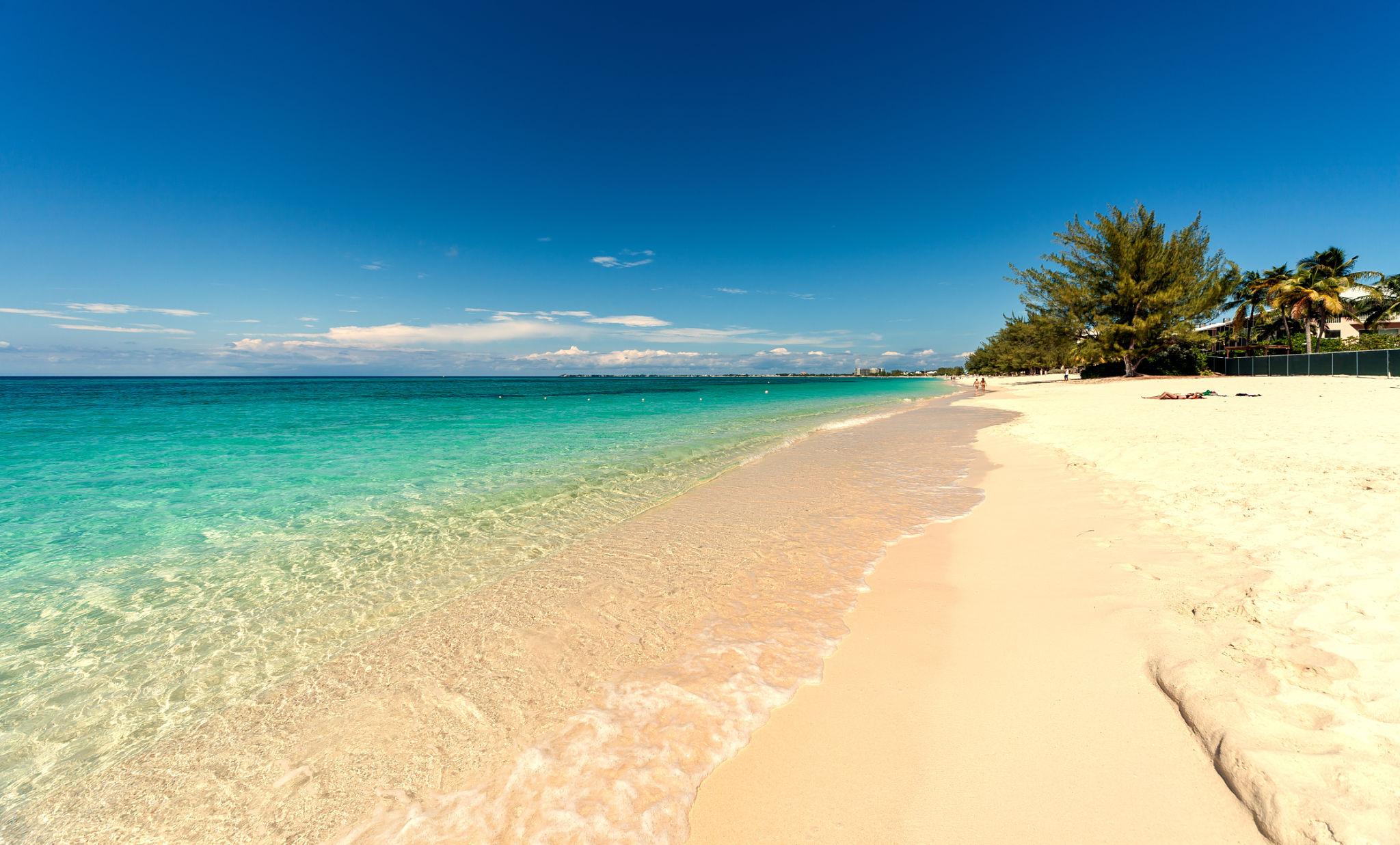 Seven Mile Beach Caribbean shoreline at sunset