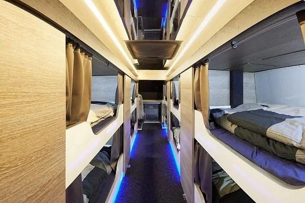 Sleeper bus interior with sleeping cabins