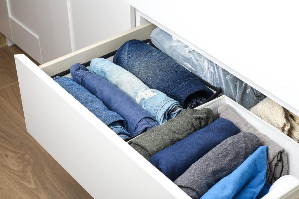 Drawer style rolled clothes showing a clothes folding trick for suitcase organisation