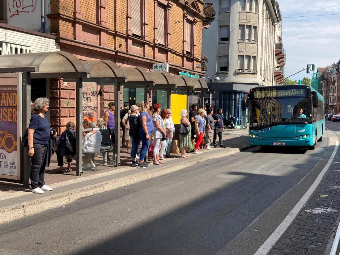 Passengers waiting at bus stop